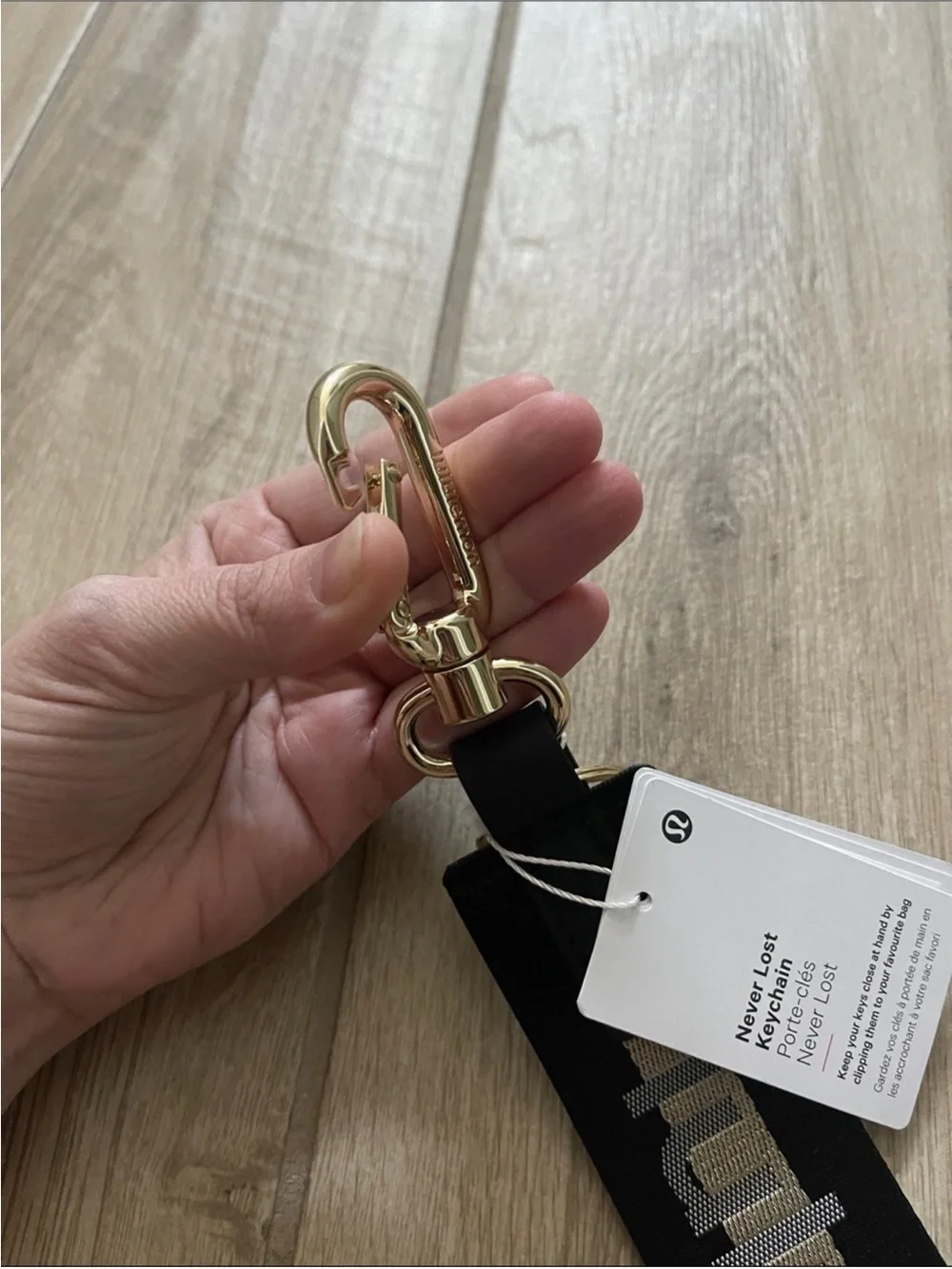 NWT Never Lost Keychain Black/ Gold Wordmark O/S